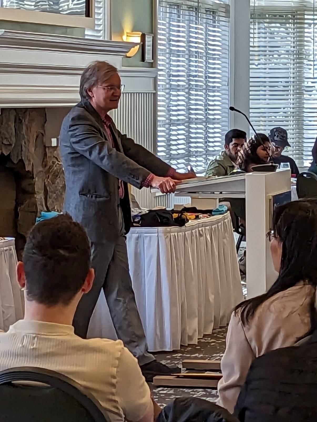 Man standing at podium speaking